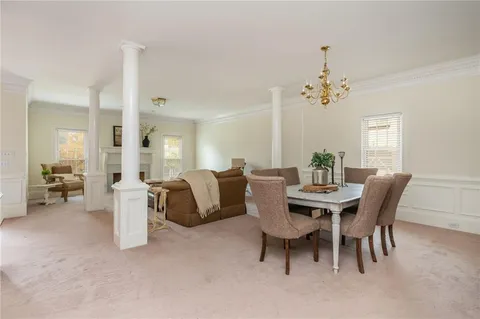 a kitchen with stainless steel appliances granite countertop a sink dishwasher stove and cabinets