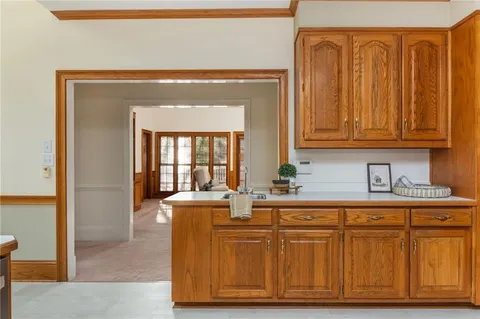 a spacious bedroom with a bed and a large window