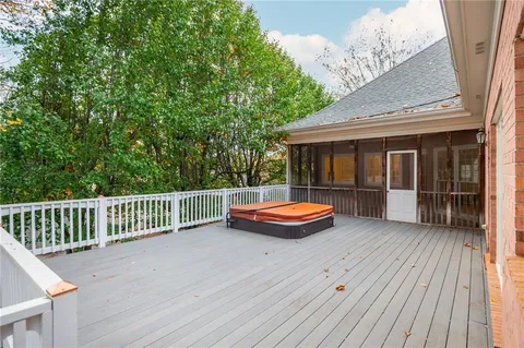 a view of a room with wooden floor and furniture