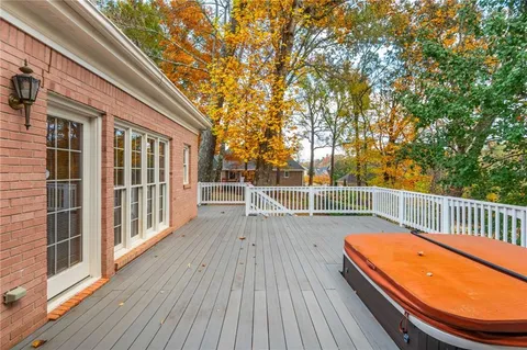 a view of a backyard with a large tree