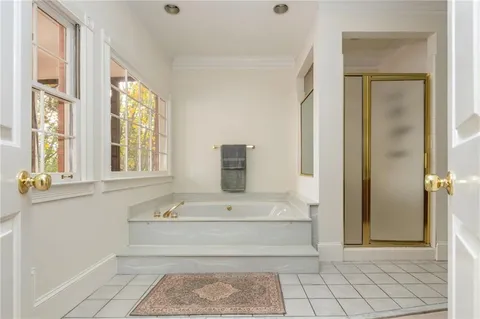 a view of a house with backyard and balcony