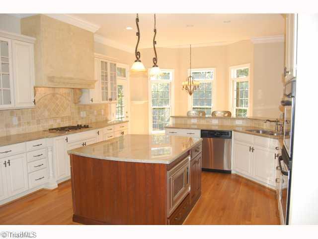 8405 Oakchester Court Oak Ridge, NC 27310 - Photo 3 of 6 Kitchen. indulge your inner cook in this wonderful kitchen. Perfect venue for entertaining.