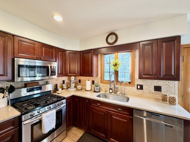 1325 Foxpointe Drive Sycamore, IL 60178 - Photo 16 of 55 a kitchen with a sink stove top oven and microwave