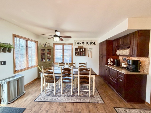 1325 Foxpointe Drive Sycamore, IL 60178 - Photo 18 of 55 a dining room with wooden floor and large window