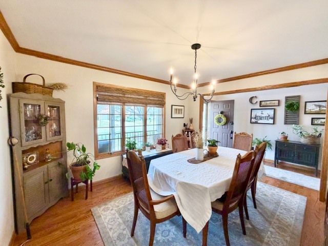 1325 Foxpointe Drive Sycamore, IL 60178 - Photo 21 of 55 a view of a dining room with furniture window and wooden floor