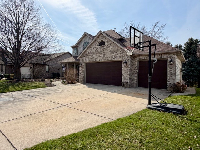 1325 Foxpointe Drive Sycamore, IL 60178 - Photo 3 of 55 a front view of a house with a garden
