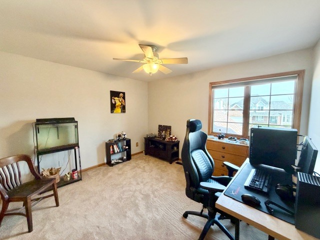 1325 Foxpointe Drive Sycamore, IL 60178 - Photo 40 of 55 a living room with furniture a desk and chair with windows