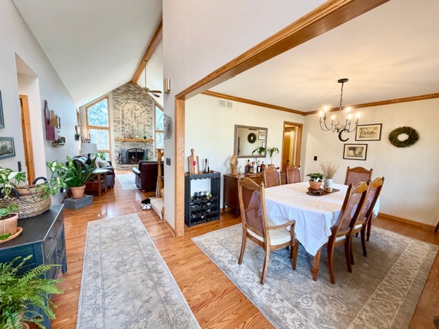 1325 Foxpointe Drive Sycamore, IL 60178 - Photo 4 of 55 a view of a dining room and livingroom with furniture wooden floor and a rug