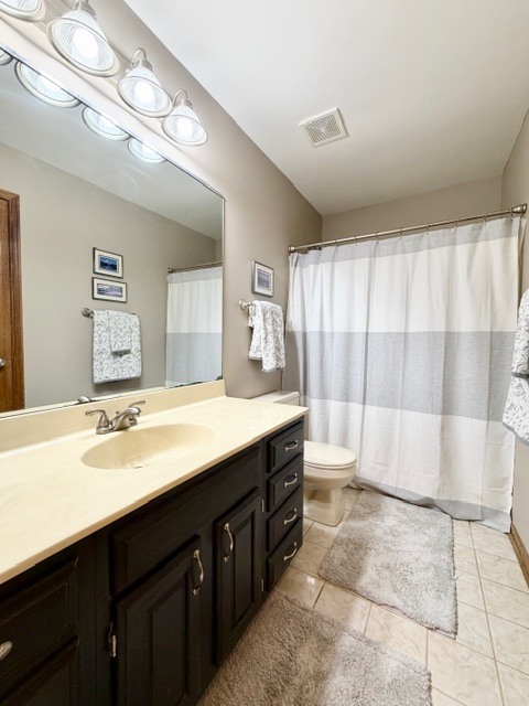 1325 Foxpointe Drive Sycamore, IL 60178 - Photo 44 of 55 a bathroom with a double vanity sink toilet and a mirror