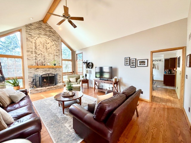 1325 Foxpointe Drive Sycamore, IL 60178 - Photo 7 of 55 a living room with furniture a large window and a fireplace