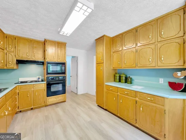 a bathroom with a sink toilet and mirror