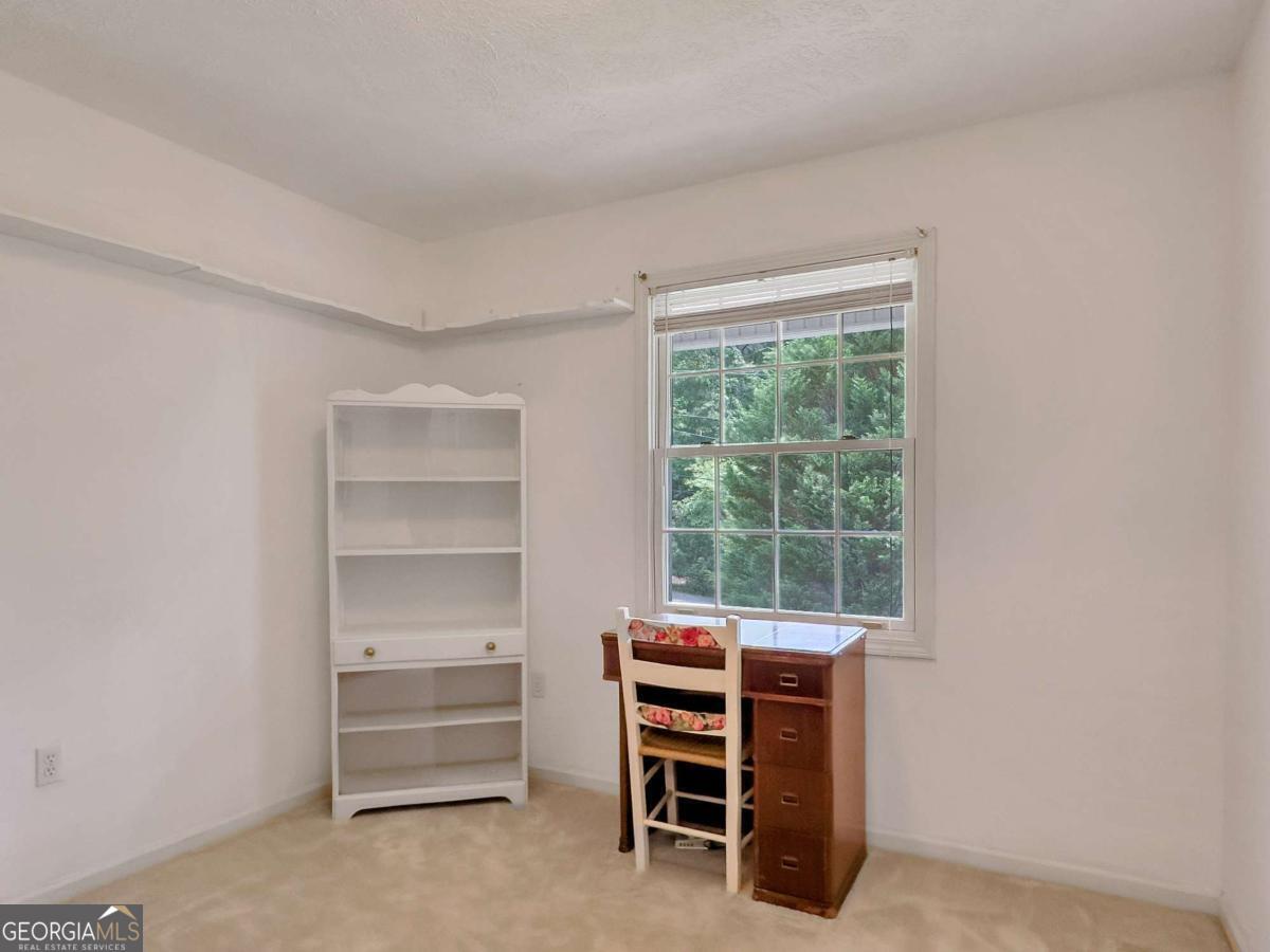 240 Riverview Road Jackson, GA 30233 - Photo 35 of 79 a room with a furniture and a window