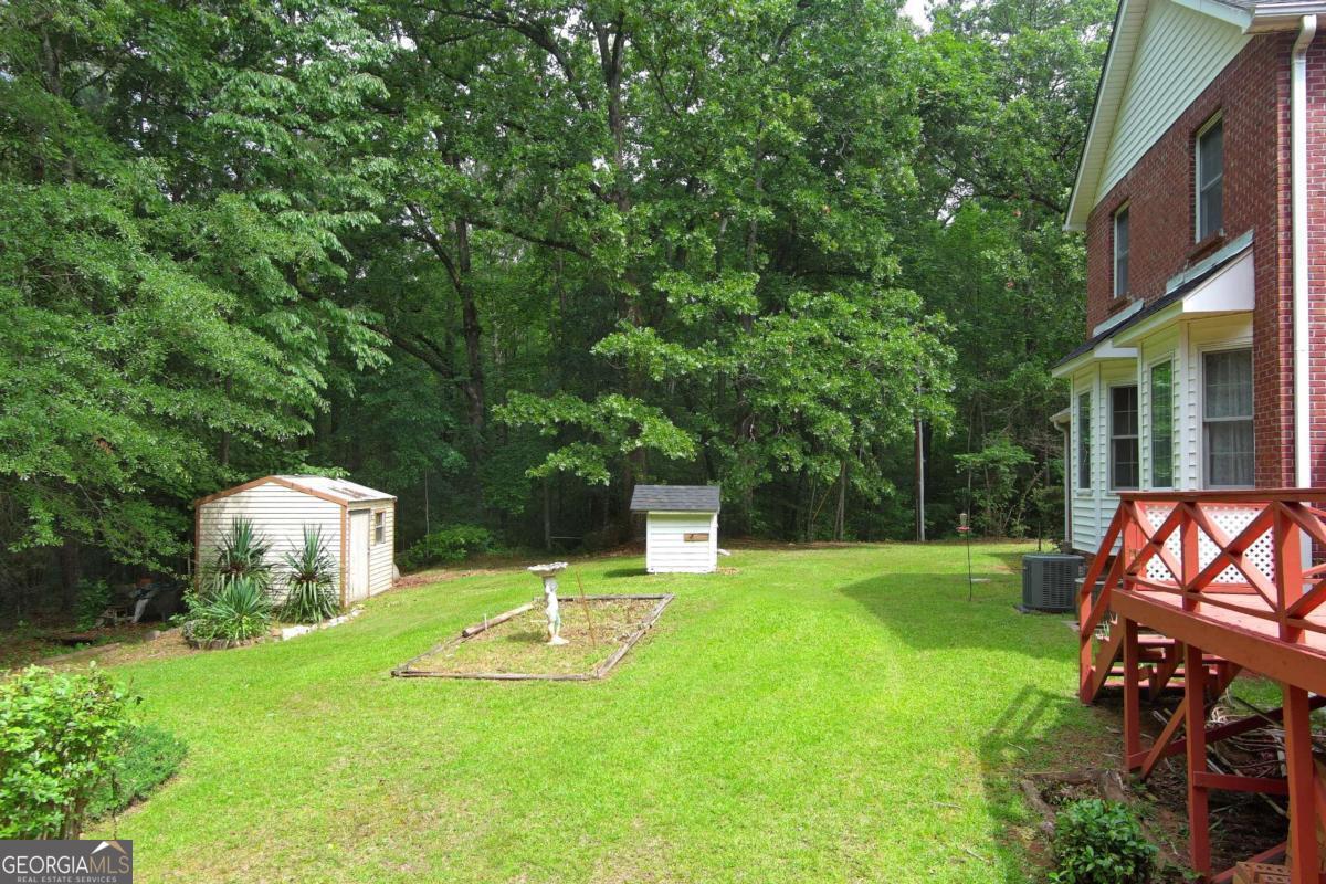 240 Riverview Road Jackson, GA 30233 - Photo 53 of 79 a view of a chairs and table in the backyard