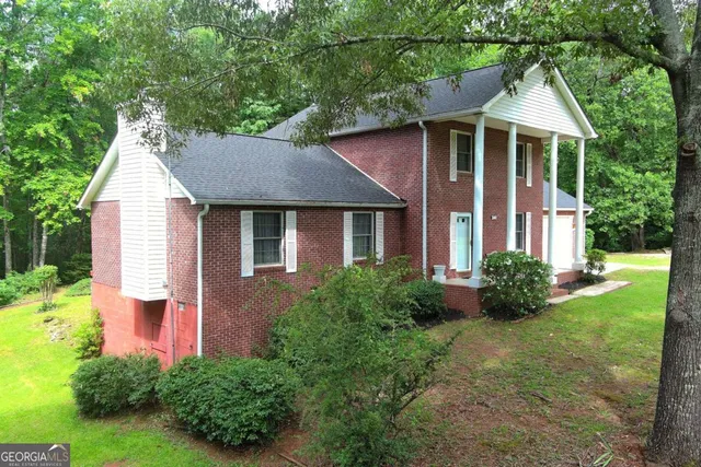 a view of front of a house with outdoor seating