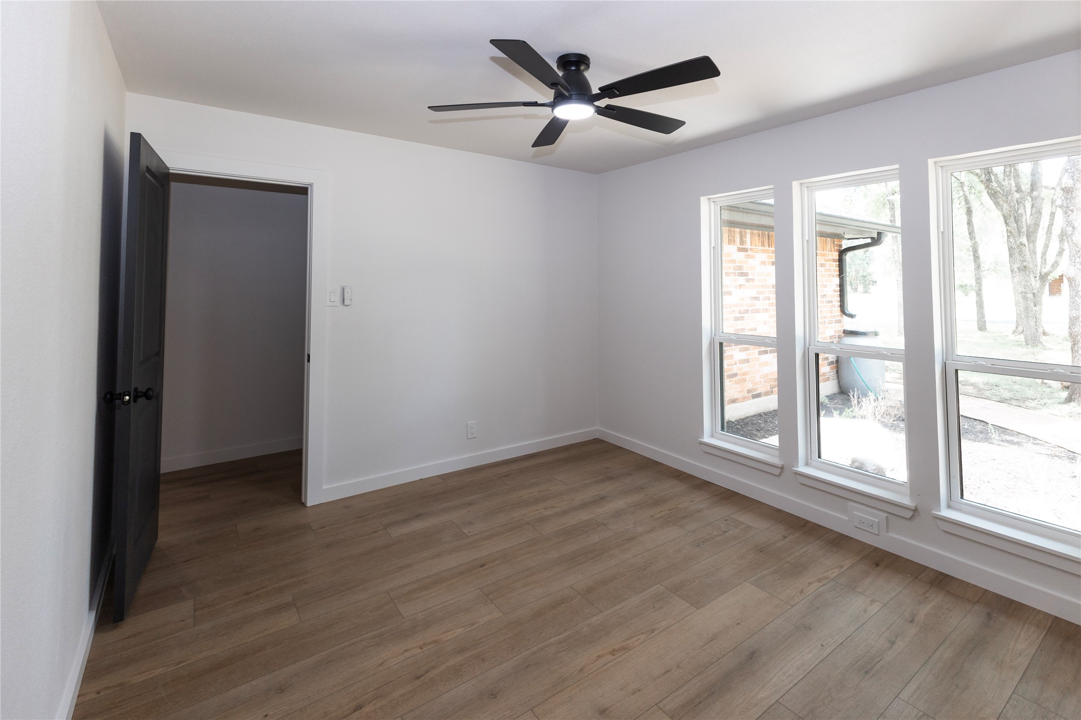 205 Bello Circle Georgetown, TX 78628 - Photo 8 of 36 A well-lit room with wood flooring offers comfort and a tranquil atmosphere.