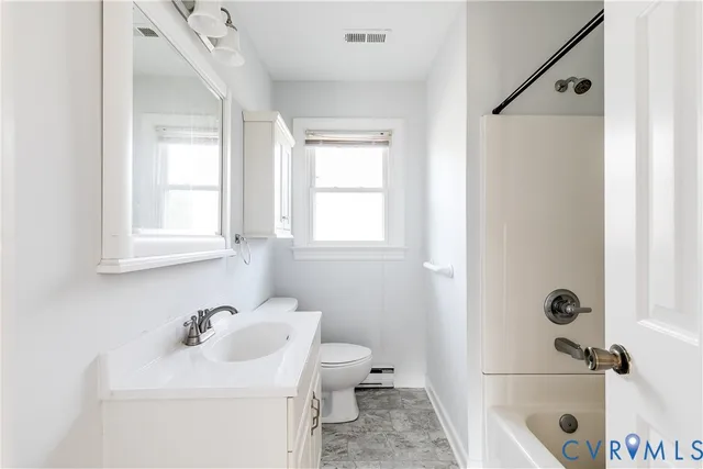 a bathroom with a sink a toilet and a tub