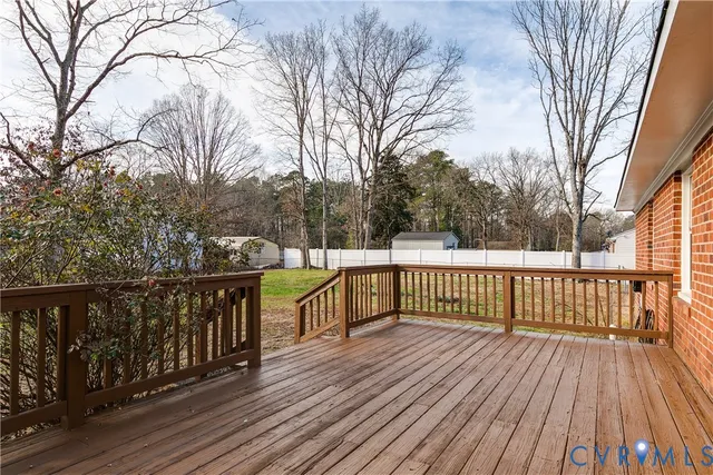 a view of a deck with trees