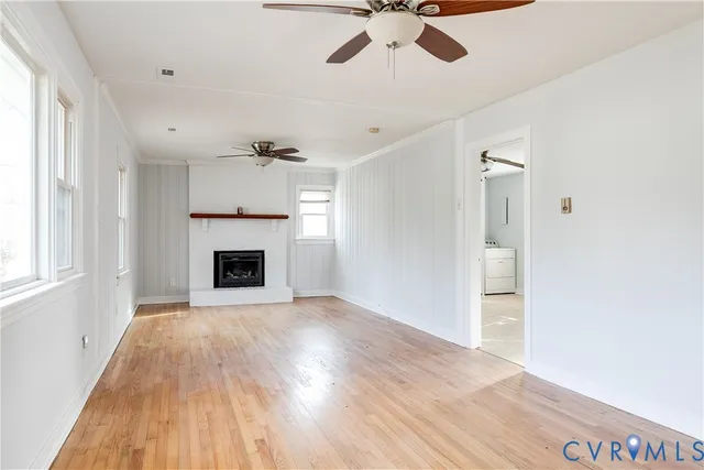 a view of an empty room with a fireplace