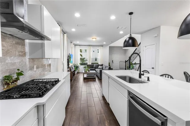 a kitchen with sink and stove