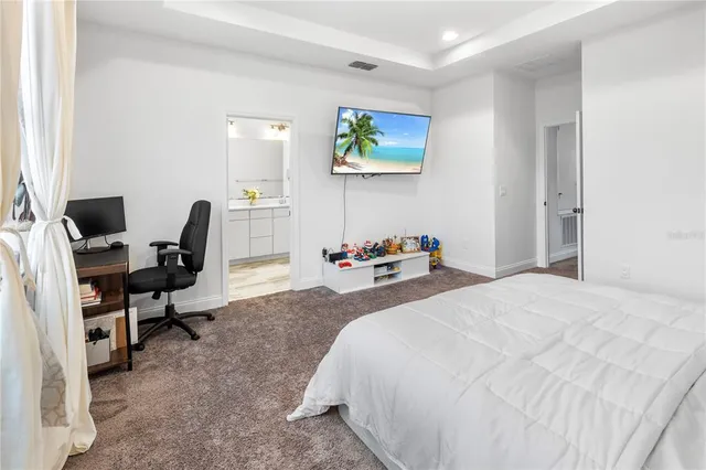 a bedroom with a bed and furniture