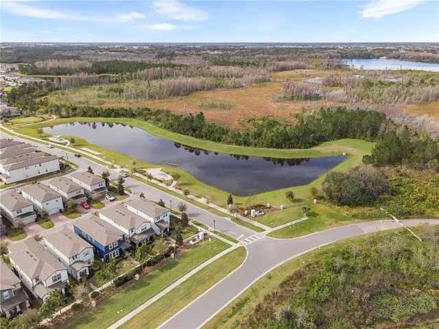 an aerial view of residential houses with outdoor space