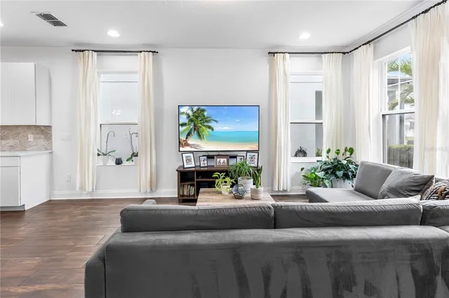 a living room with furniture and a large window