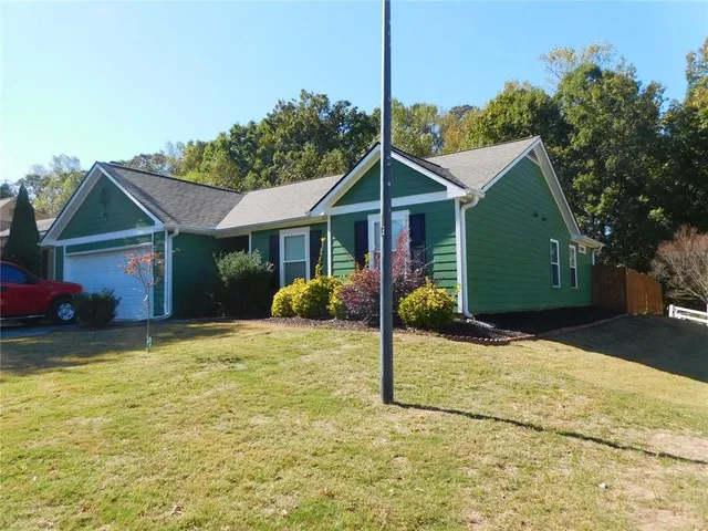 a front view of a house with a yard