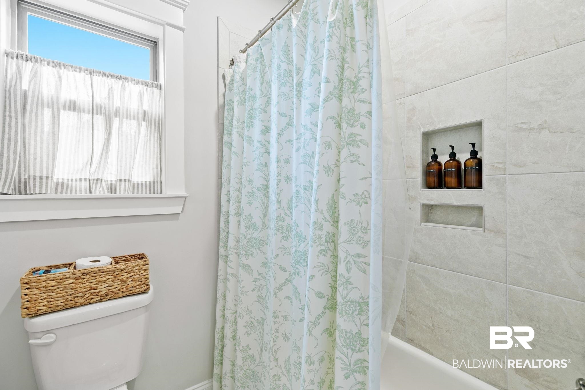 13233 Ibis Boulevard Daphne, AL 36527 - Photo 45 of 100 Bathtub and shower combination with light-toned wall tiling, complete with two recessed shower niches
