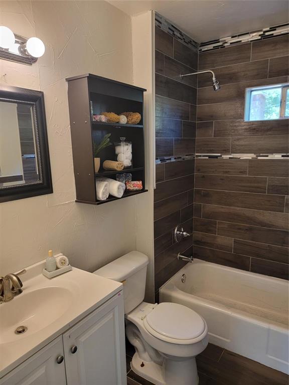 2223 Anderson Street Irving, TX 75062 - Photo 5 of 9 a bathroom with a sink toilet and shower