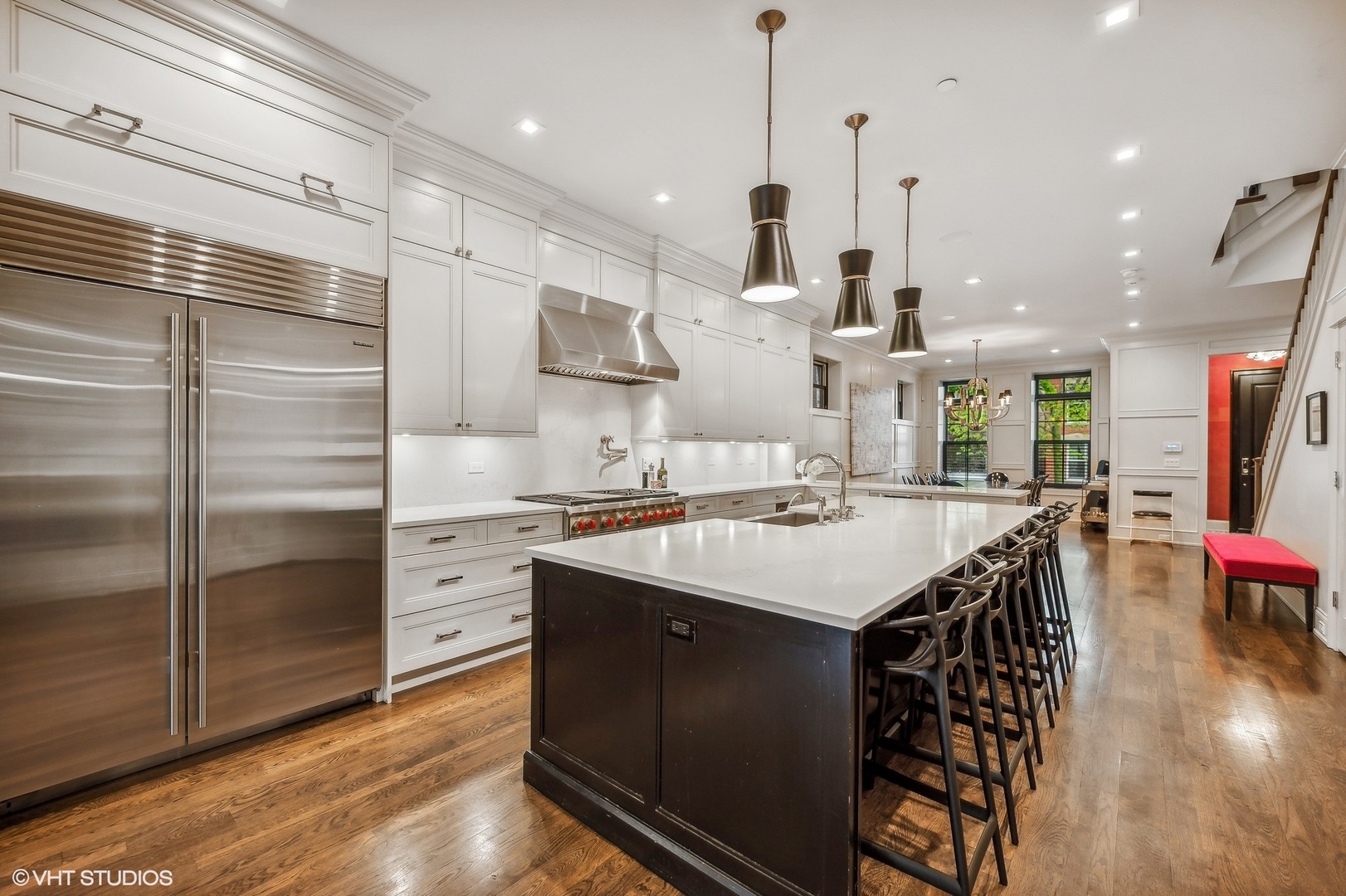 1855 North Dayton Street Chicago, IL 60614 - Photo 8 of 51 a large kitchen with stainless steel appliances kitchen island granite countertop a table chairs sink and cabinets