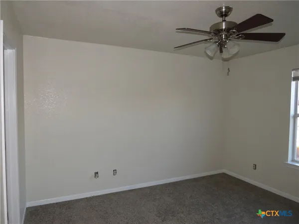 a view of a room with a fan