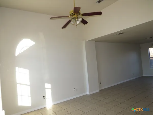 a view of empty room with windows