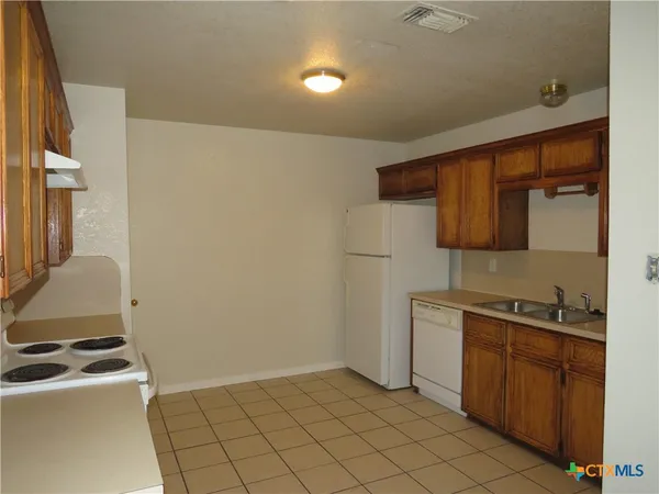 a kitchen with a stove and a microwave