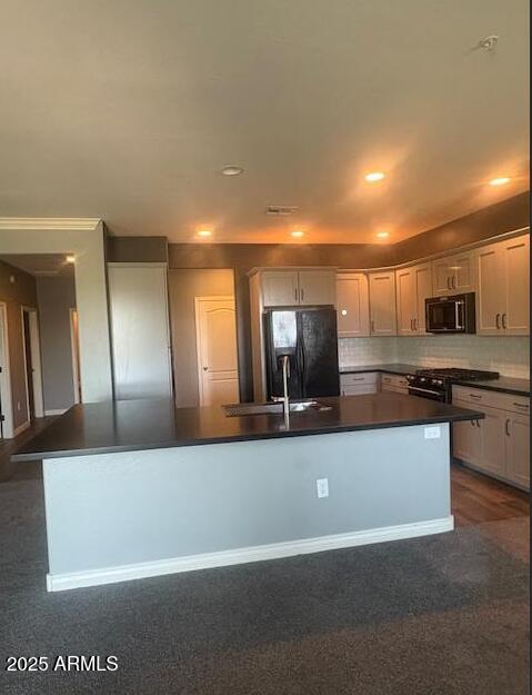 2425 West Bronco Butte Trail, Unit 2028 Phoenix, AZ 85085 - Photo 16 of 46 a large kitchen with stainless steel appliances kitchen island a large counter top