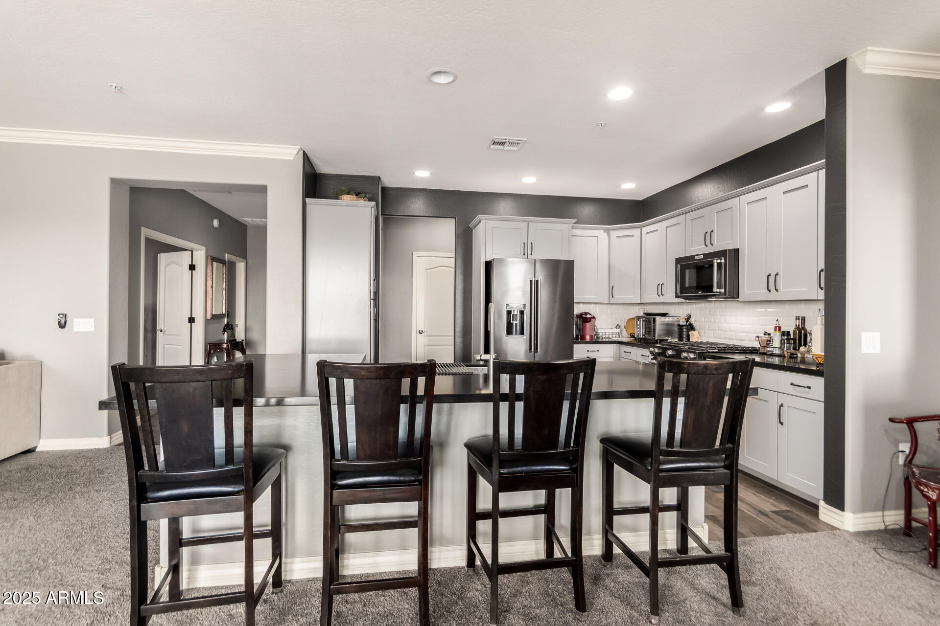 2425 West Bronco Butte Trail, Unit 2028 Phoenix, AZ 85085 - Photo 20 of 46 a view of a dining room with furniture