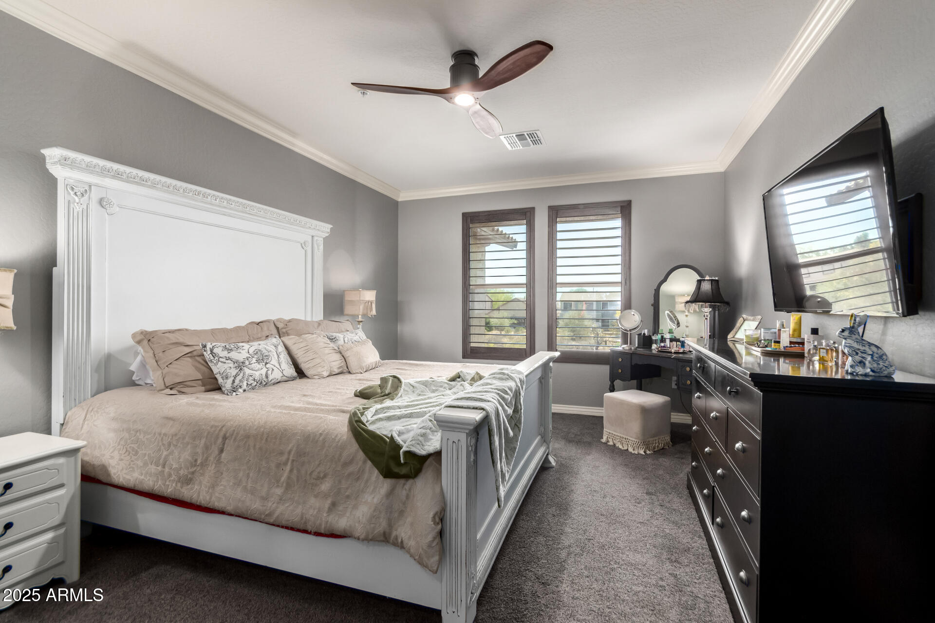 2425 West Bronco Butte Trail, Unit 2028 Phoenix, AZ 85085 - Photo 23 of 46 a bedroom with bed a flat tv screen and next to a window