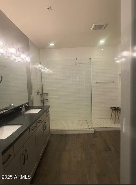2425 West Bronco Butte Trail, Unit 2028 Phoenix, AZ 85085 - Photo 29 of 46 a bathroom with a granite countertop sink a large mirror and a shower
