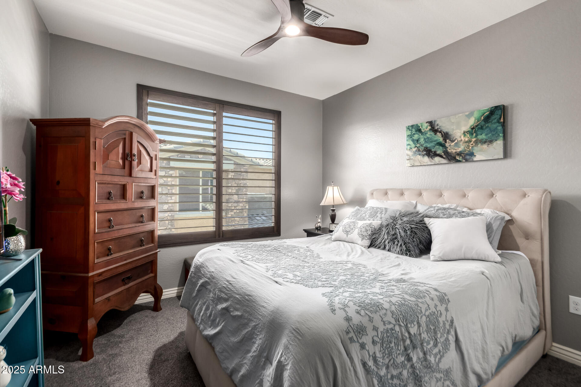 2425 West Bronco Butte Trail, Unit 2028 Phoenix, AZ 85085 - Photo 32 of 46 a bedroom with a bed and a television