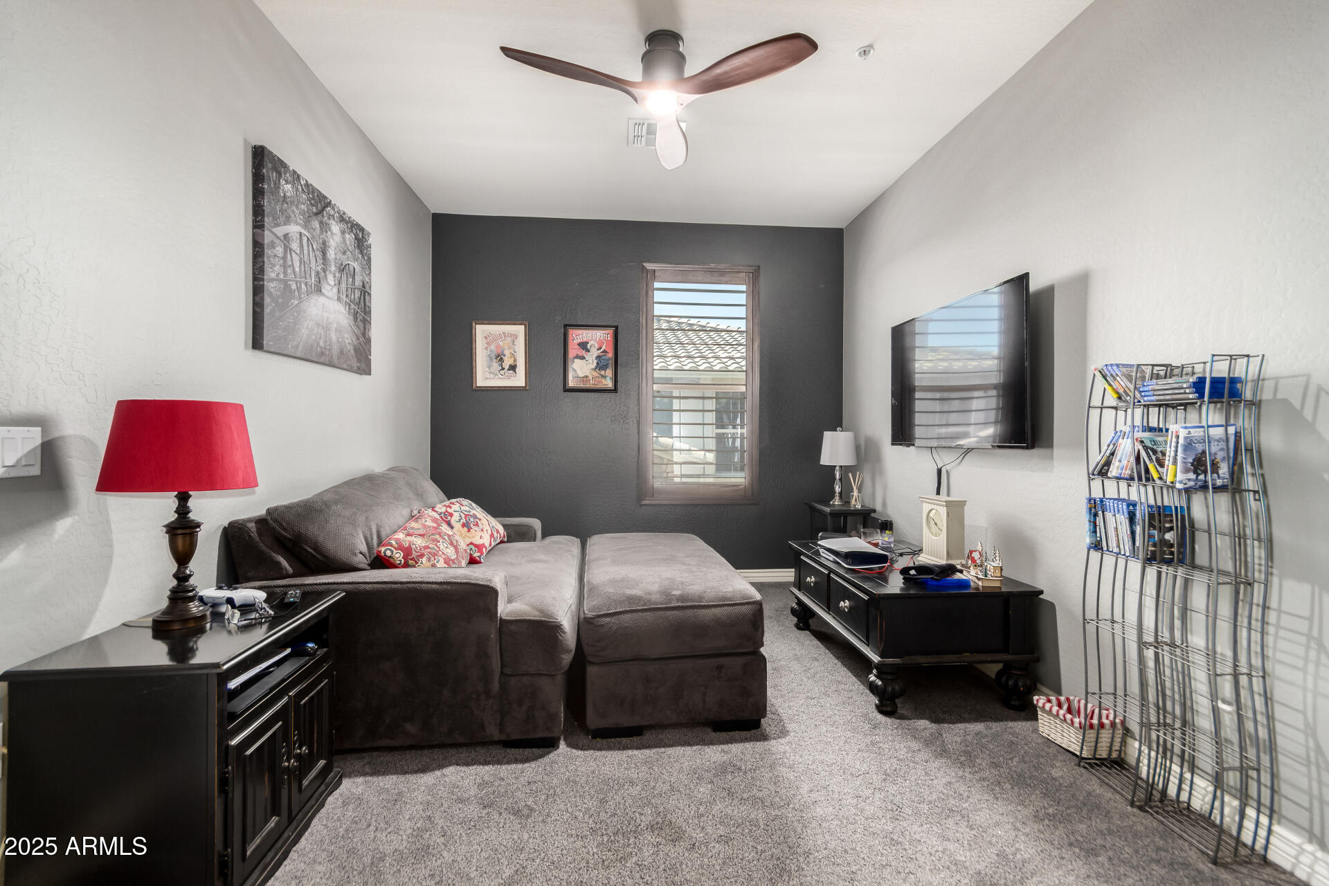 2425 West Bronco Butte Trail, Unit 2028 Phoenix, AZ 85085 - Photo 35 of 46 a bedroom with a bed and a flat screen tv
