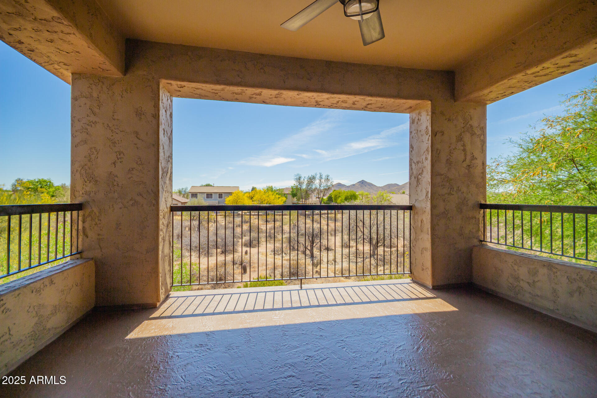 2425 West Bronco Butte Trail, Unit 2028 Phoenix, AZ 85085 - Photo 38 of 46 a view of a room with wooden floor and balcony