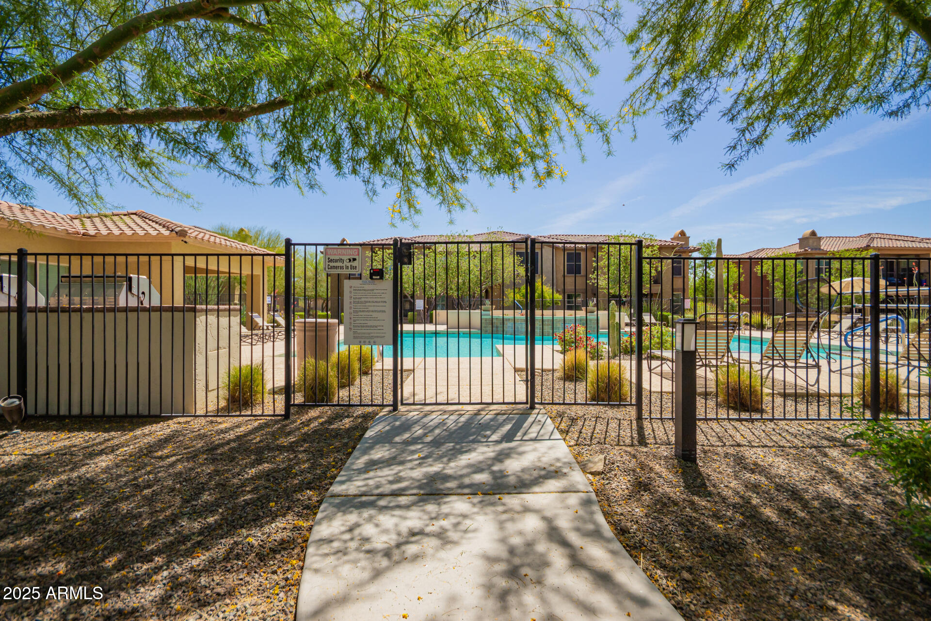 2425 West Bronco Butte Trail, Unit 2028 Phoenix, AZ 85085 - Photo 43 of 46 a view of a backyard