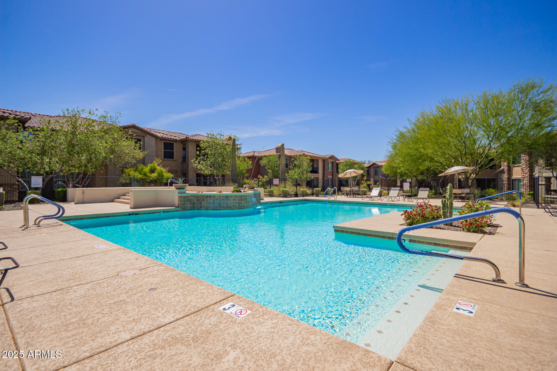 2425 West Bronco Butte Trail, Unit 2028 Phoenix, AZ 85085 - Photo 44 of 46 a view of swimming pool with outdoor seating and yard