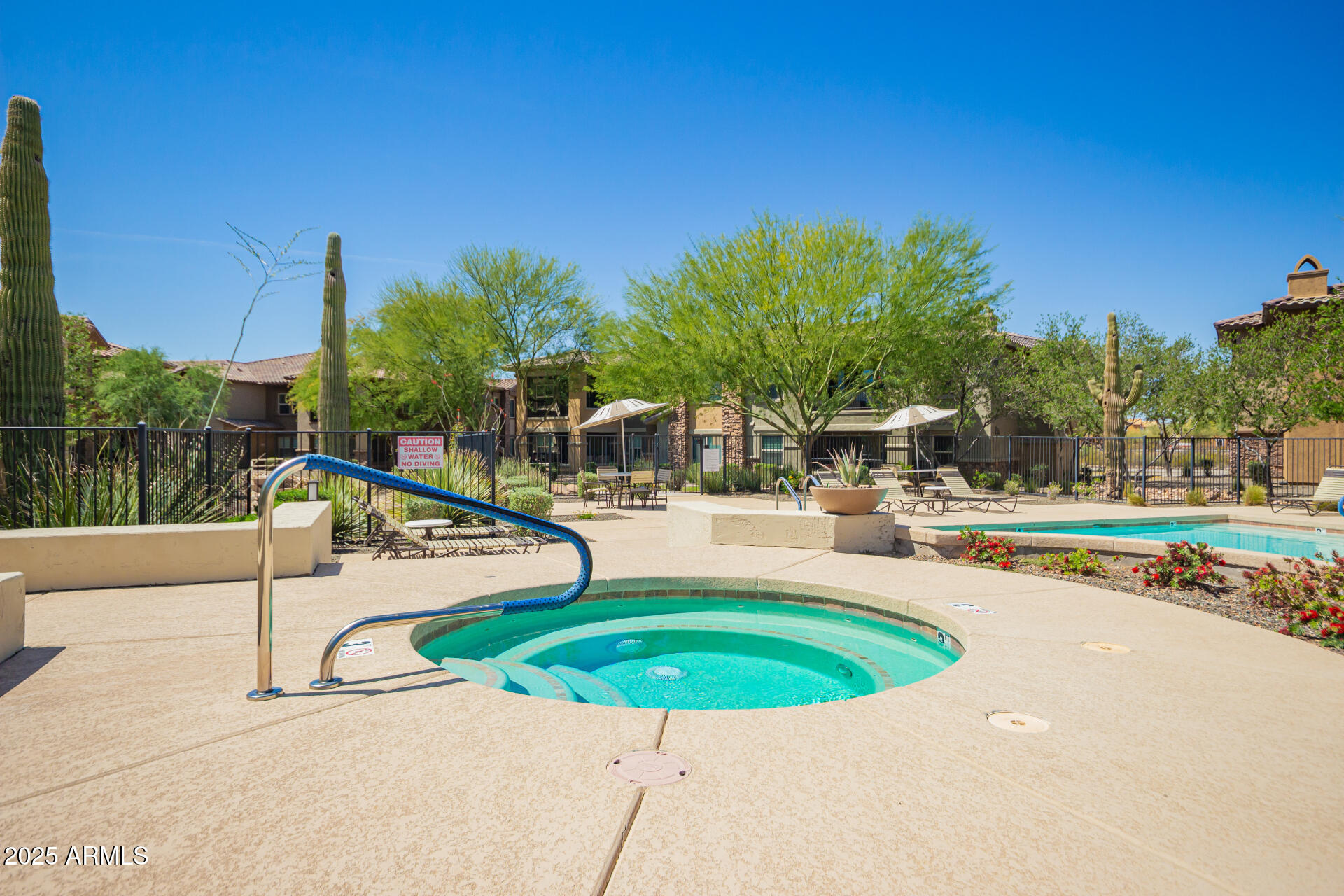 2425 West Bronco Butte Trail, Unit 2028 Phoenix, AZ 85085 - Photo 45 of 46 a view of a swimming pool with a patio