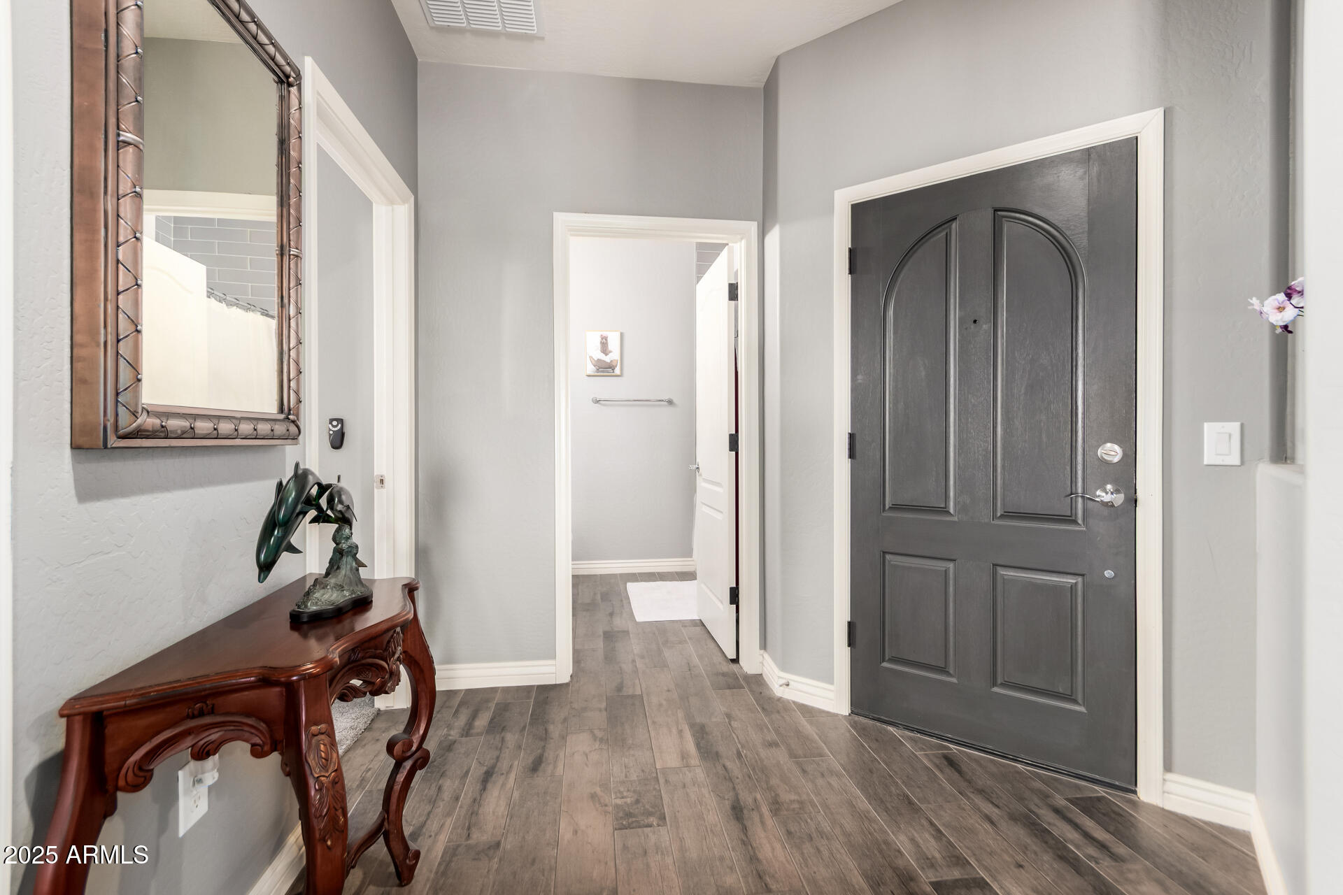2425 West Bronco Butte Trail, Unit 2028 Phoenix, AZ 85085 - Photo 5 of 46 a view of a hallway with wooden floor and closet