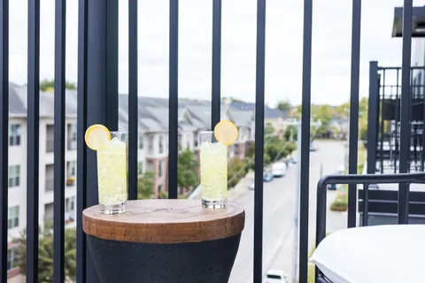 a dining room with furniture and a window