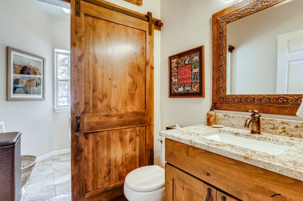 98 Lookout Ridge Drive, Unit 98 Dillon, CO 80435 - Photo 13 of 29 REMODELD BATHROOM with GRANITE counter, NEW TILE, BARN DOOR SLIDER...