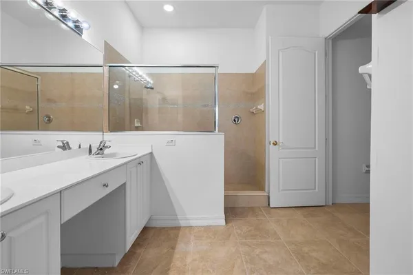 a bathroom with a double vanity sink and mirror