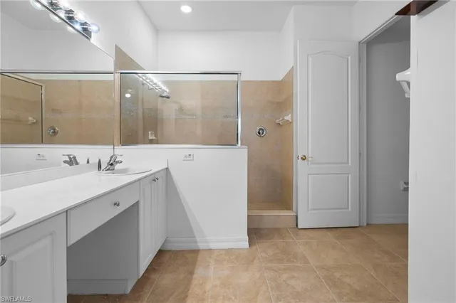a bathroom with a double vanity sink and mirror