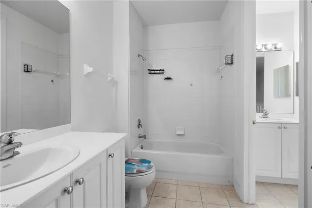 a bathroom with a bathtub shower sink and toilet