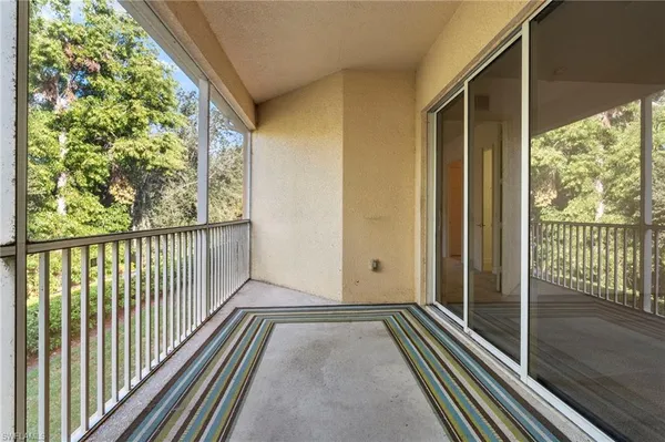 a view of a balcony with wooden floor